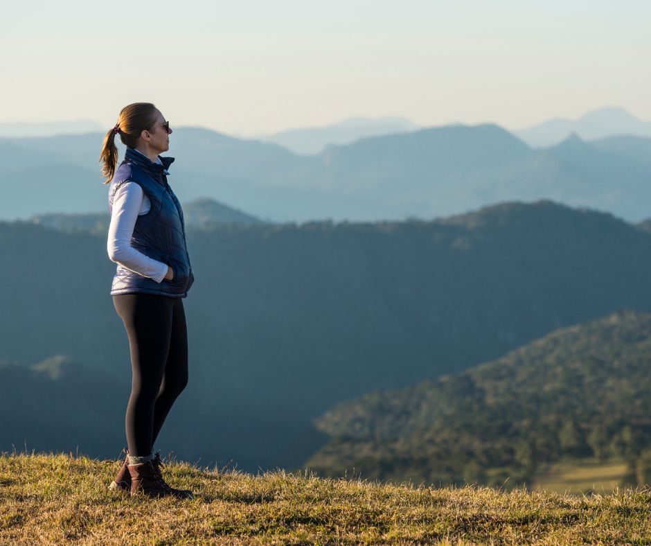 Woman standing in the mountains